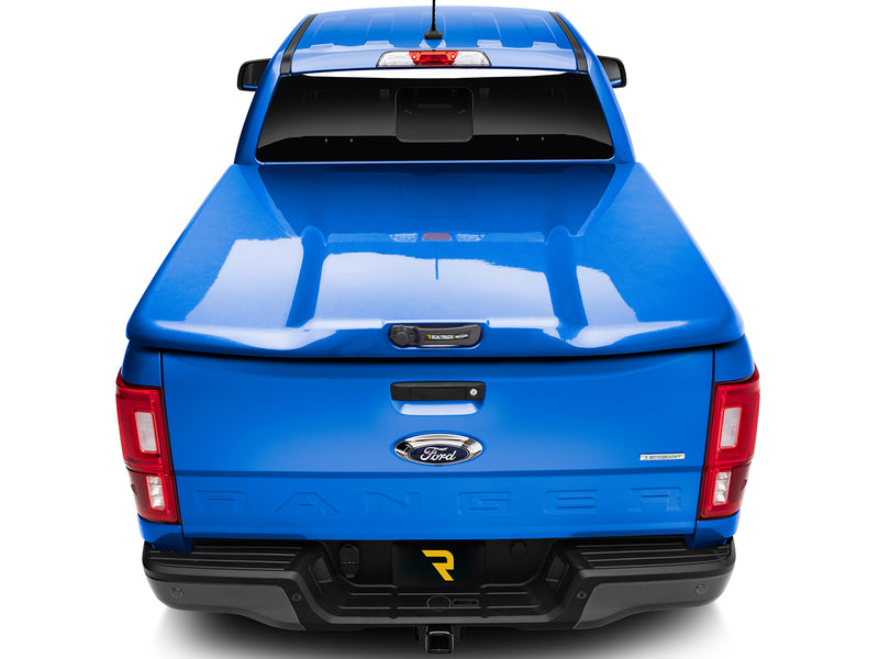 UnderCover Elite LX one-piece tonneau cover closed and latched, straight rear view with the whole lid and both bed rails square to the camera.