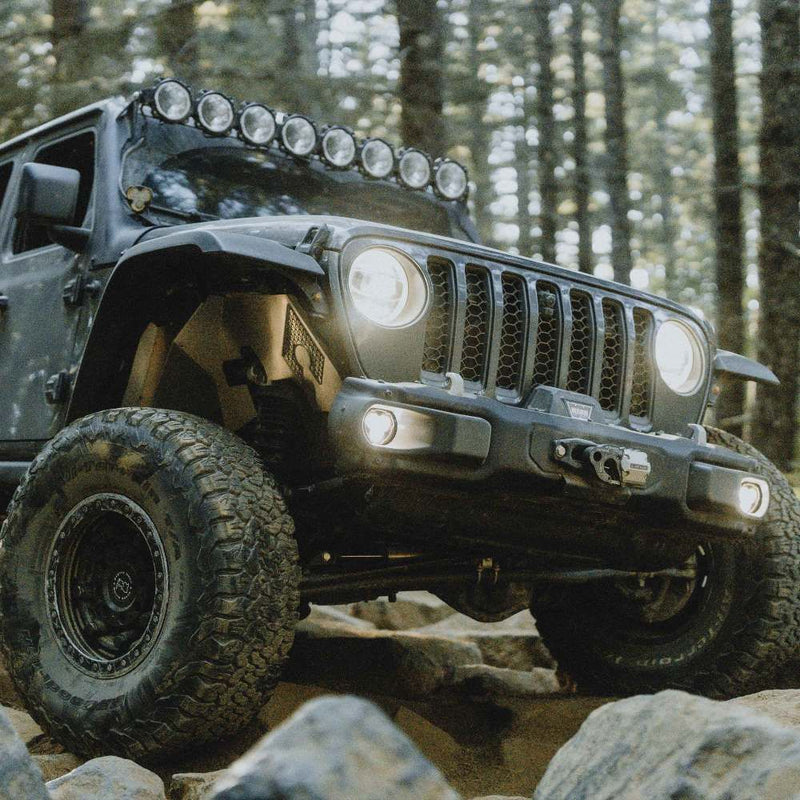 KC HiLiTES FLEX ERA 3 Dual-Mode SAE Fog Light Kit, Steel Bumper, Jeep Wrangler with fog lights on, crawling rocks