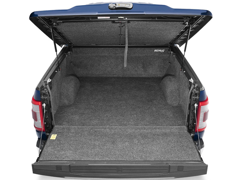 UnderCover Elite LX one-piece tonneau cover raised with the tailgate down on a second pickup, straight rear view the full depth of the box.