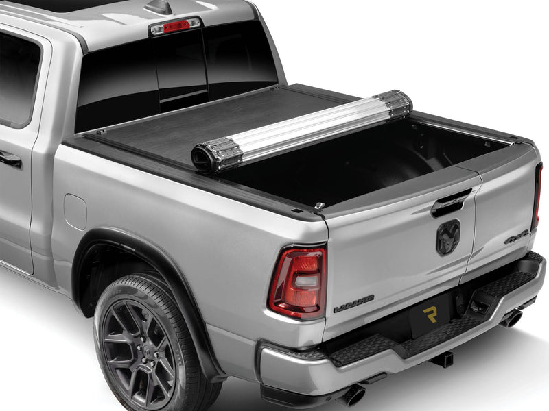 BAK Revolver X2 hard roll-up tonneau cover partially rolled toward the bulkhead