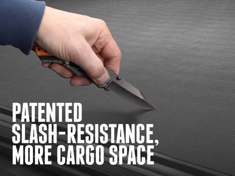A knife drawn across the closed BAK Revolver X4 TS aluminum-slat surface in a slash-resistance test