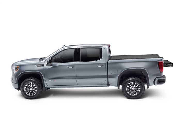 2019-2026 Chevrolet Silverado / GMC Sierra 1500 with the BAK Revolver X4s hard roll-up tonneau cover, side profile, cover closed and flush to the bed rails