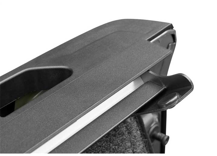 2019-2026 Chevrolet Silverado / GMC Sierra 1500 with the BAK Revolver X4s hard roll-up tonneau cover, close-up of the rear corner cap and rail