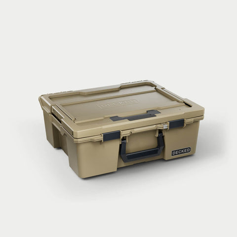 Desert Tan DECKED Halfrack 32 D-co case closed, three-quarter studio view showing the black bail handle and clutch latches