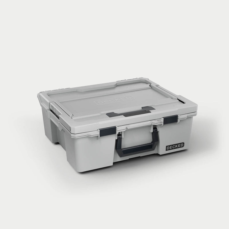 Cool Gray DECKED Halfrack 32 D-co case closed, three-quarter studio view showing the bail handle and clutch latches