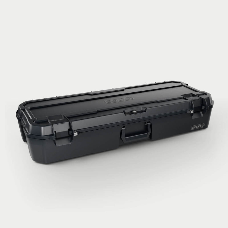 Black DECKED Honcho 80 D-co case closed, three-quarter studio view showing the long profile, bail handle and cam latches