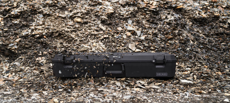 Black DECKED Honcho 80 closed on shale scree outdoors