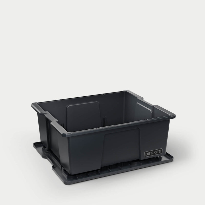 Black DECKED Payloader 32 with the lid removed and set beneath the bin, showing the open tub
