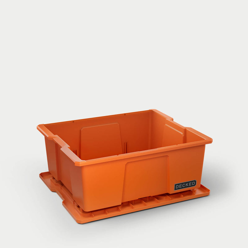 Blaze Orange DECKED Payloader 32 with the lid removed and set beneath the bin, showing the open tub