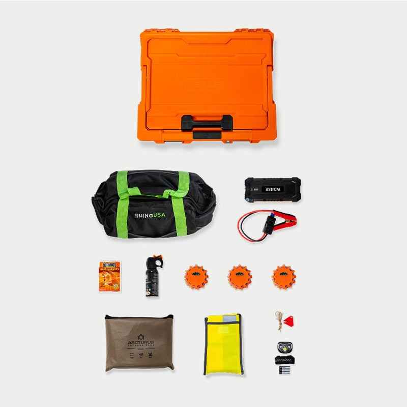 The closed Blaze Orange DECKED case above a flat lay of the Roadside Emergency OS Kit contents