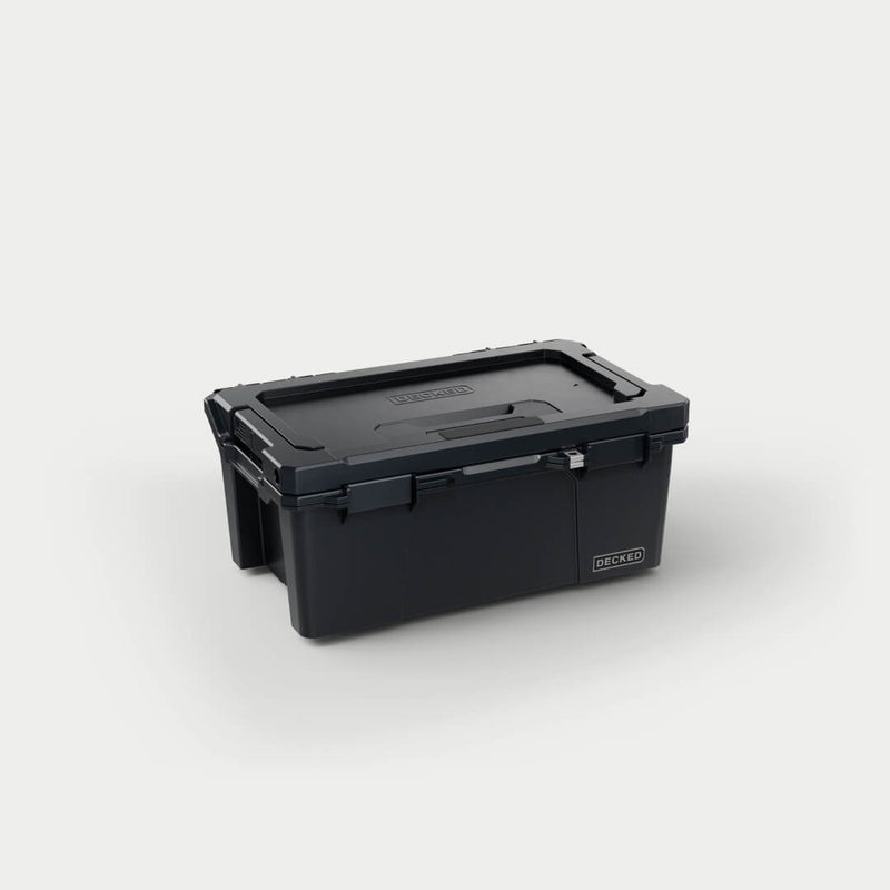 Black DECKED Sixer 16 D-co case closed, three-quarter studio view showing the recessed lid handle and clutch latches