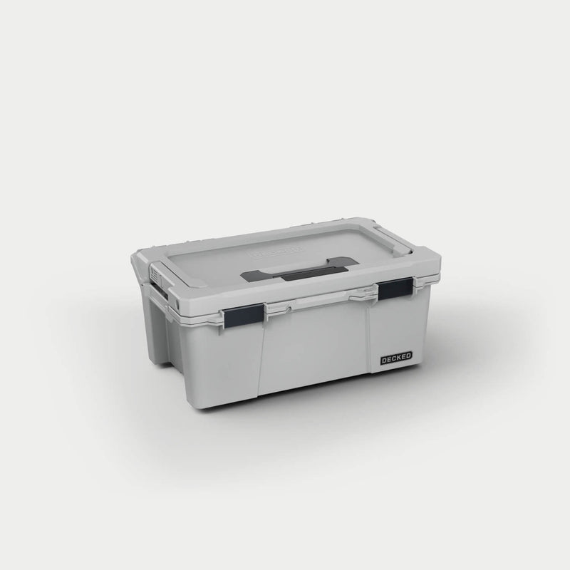 Cool Gray DECKED Sixer 16 D-co case closed, three-quarter studio view showing the lid handle and black clutch latches