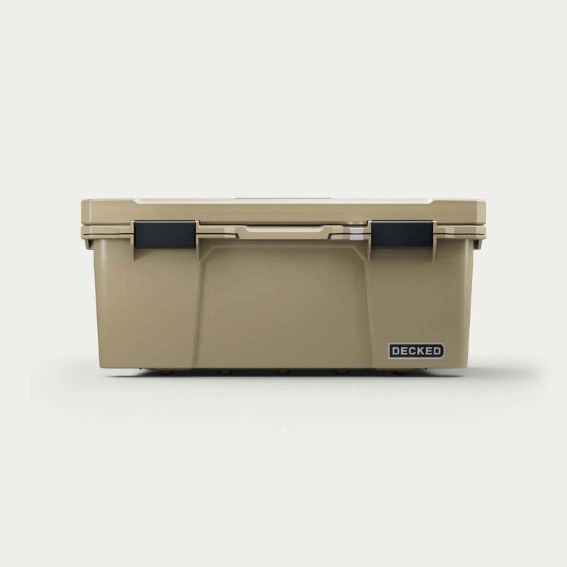 Straight-on front view of the closed Desert Tan DECKED Sixer 16 showing the lid gasket line and both latches