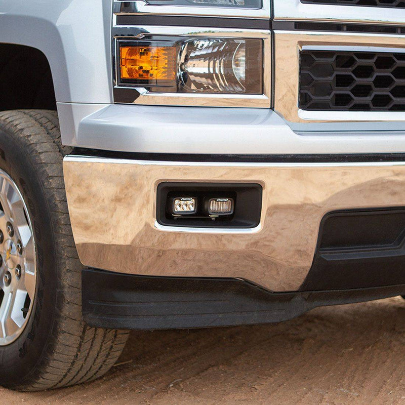 Rigid SR-M Series PRO SAE fog pods installed in the bumper of a Chevrolet Silverado