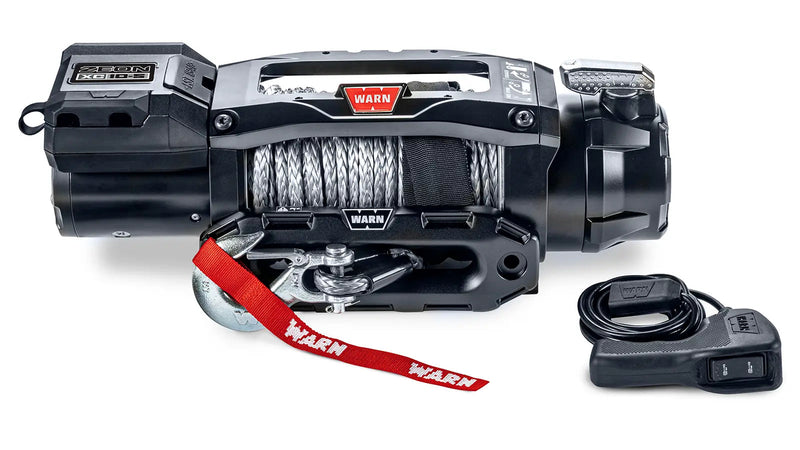Warn ZEON XC 10-S low-profile winch, front studio view with Spydura synthetic rope spooled, Epic hawse fairlead and corded remote alongside
