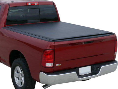Red pickup on a white background with a black vinyl roll-up tonneau cover closed flat and taut over the bed