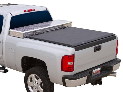 Black roll-up cover closed behind an aluminum diamond-plate crossover toolbox, studio white background, Access logo plate