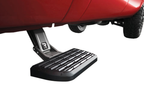 BedStep2 deployed from under the bed side of a red pickup, ahead of the rear wheel, studio background
