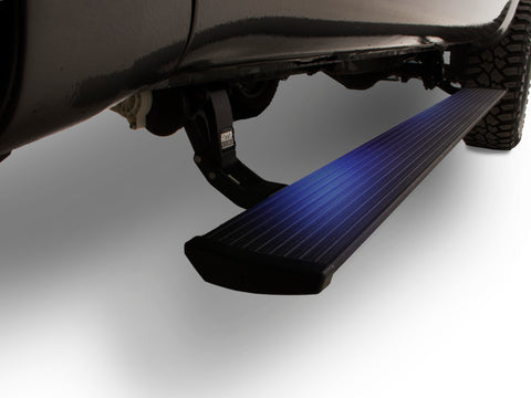 Lit PowerStep deployed under the doors of a dark pickup, studio