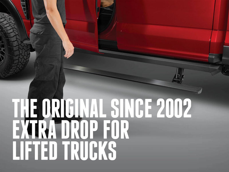 Person beside the deployed PowerStep XL of a red pickup with the text The Original Since 2002 Extra Drop for Lifted Trucks