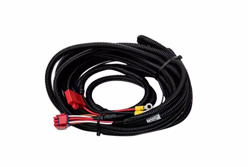 Coiled PowerStep wire harness with red and yellow connectors and ring terminal on white