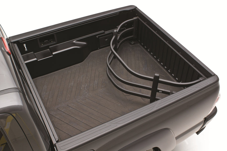 Black BedXTender HD Moto flipped inside the bed of a gray pickup against the closed tailgate