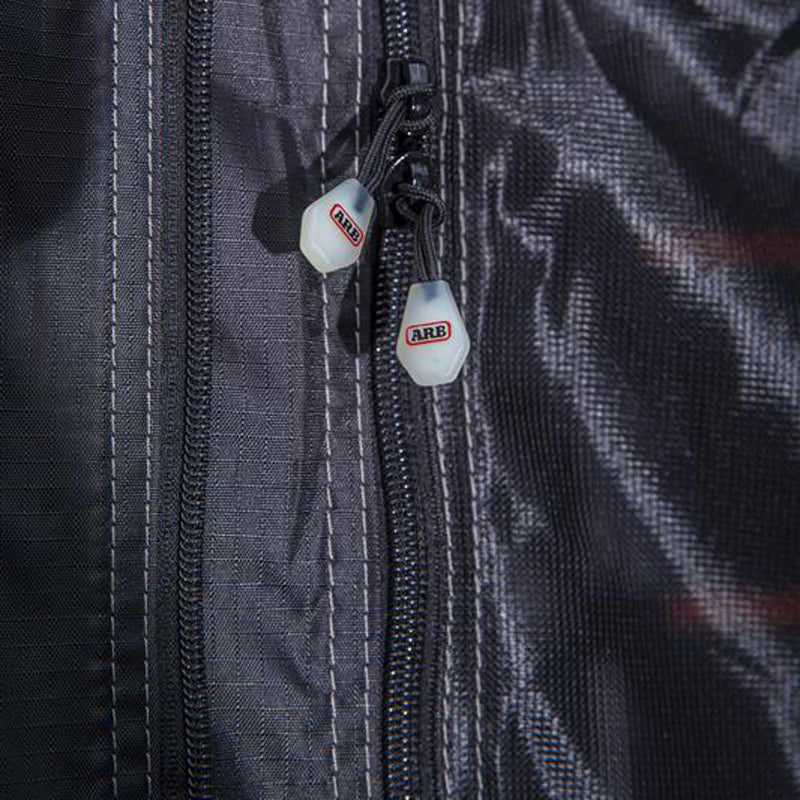 Close-up of the ARB Esperance V2 Annex 804200V2 door zips with ARB-branded molded zip pulls on grey fire-retardant tent fabric