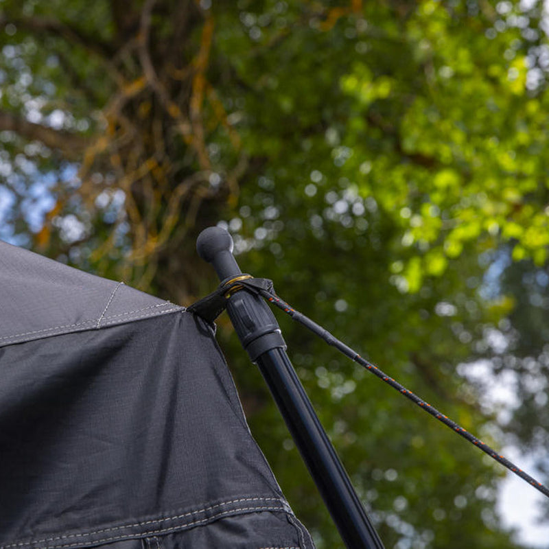 Detail of the ARB Esperance V2 Annex 804200V2 corner pole, ball-capped upright and reflective guy line tensioning the grey 200gsm canopy