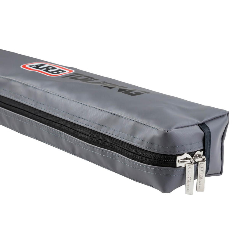 Close-up of the ARB 814301 awning soft case showing the ARB Touring logo, black zip and branded silver zipper pulls, on white