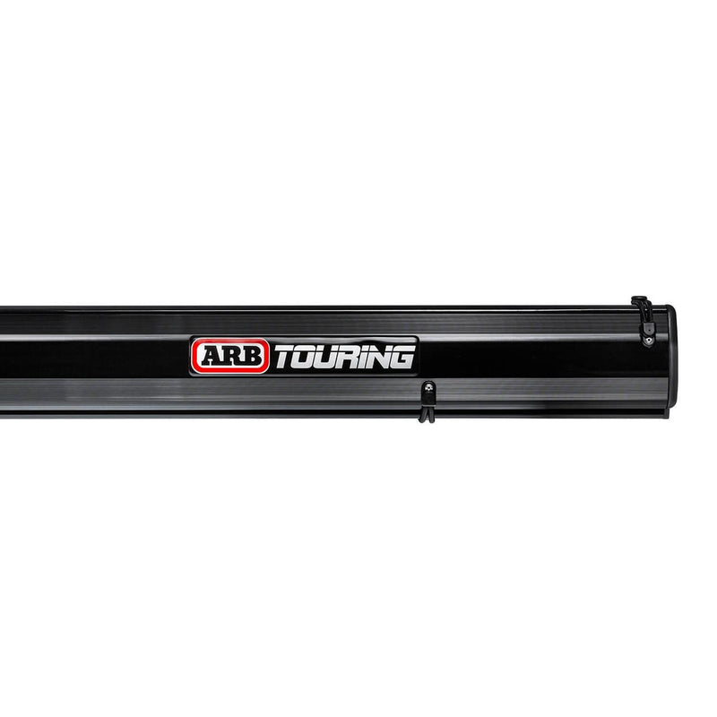 Close-up of the ARB Hard Case Awning 814412A black ribbed aluminum case showing the ARB Touring badge and mounting bracket