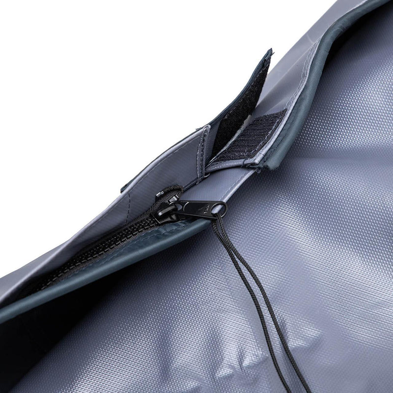 Macro of the heavy black zipper and hook-and-loop storm flap on the grey PVC ARB Rooftop Tent Cover 815100, shown against a white studio background