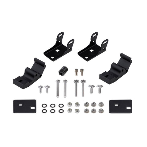 ARB Intensity pedestal mount kit contents laid out: two angled black brackets, two curved pedestal bases, two flat mounting plates, and a full set of stainless bolts, washers, lock nuts and security nuts