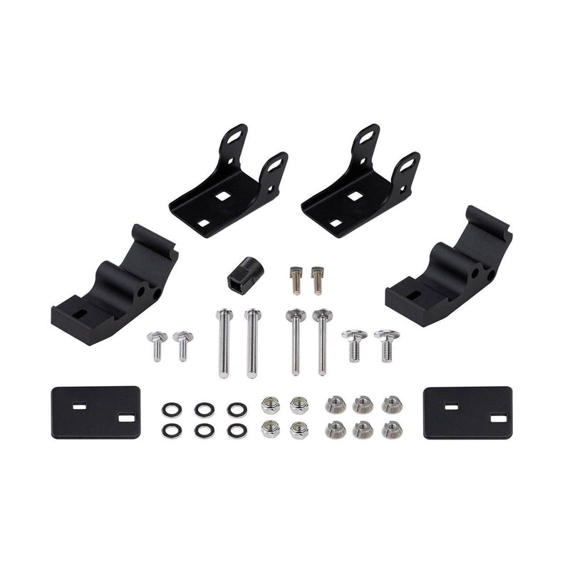 ARB Intensity pedestal mount kit contents laid out: two angled black brackets, two curved pedestal bases, two flat mounting plates, and a full set of stainless bolts, washers, lock nuts and security nuts