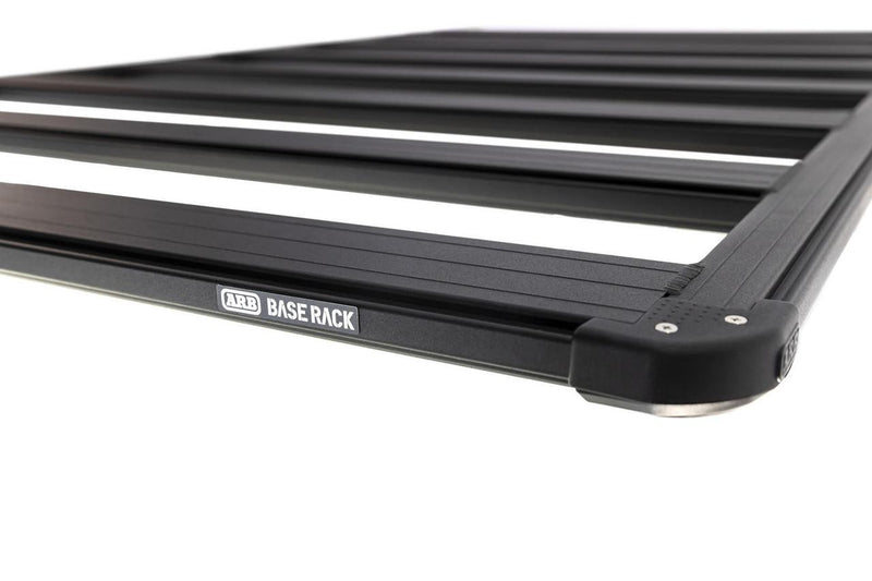 Close-up of an ARB BASE Rack corner showing the ARB BASE RACK badge, the moulded corner cap and the dovetail extrusion along the perimeter beam
