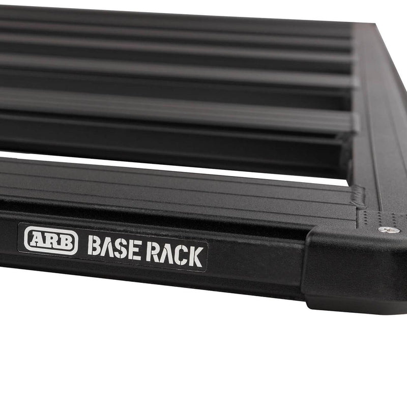 Macro detail of the ARB BASE Rack dovetail extrusion and moulded corner cap with the ARB BASE RACK badge