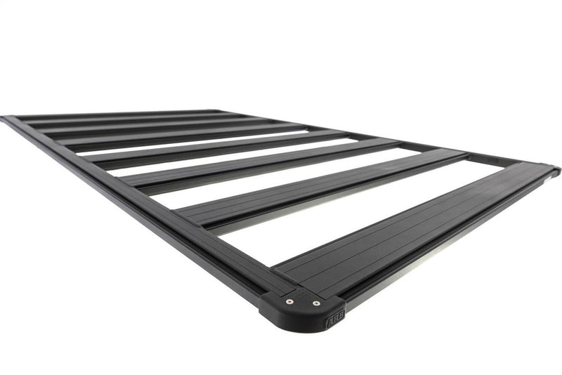 Angled detail of an ARB BASE Rack platform end rail, corner cap and the dovetail channel that accessories clamp into