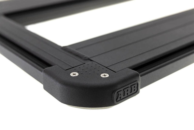 Close-up of a molded ARB corner cap joining the side rail and end beam of a BASE Rack platform