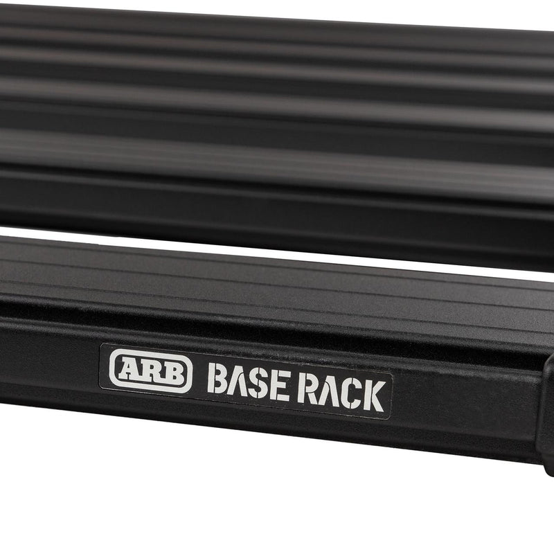 Close-up of the ARB BASE RACK logo on the black side rail of a BASE Rack platform