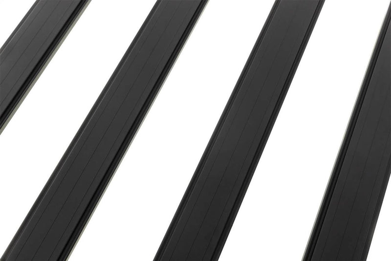 Close-up of black extruded aluminum BASE Rack cross beams on white