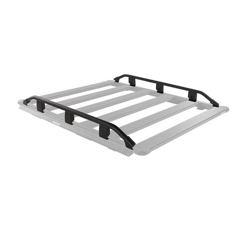 ARB BASE Rack guard rail shown in black on a ghosted grey rack outline, running along both long sides of the rack with the front and rear left completely open