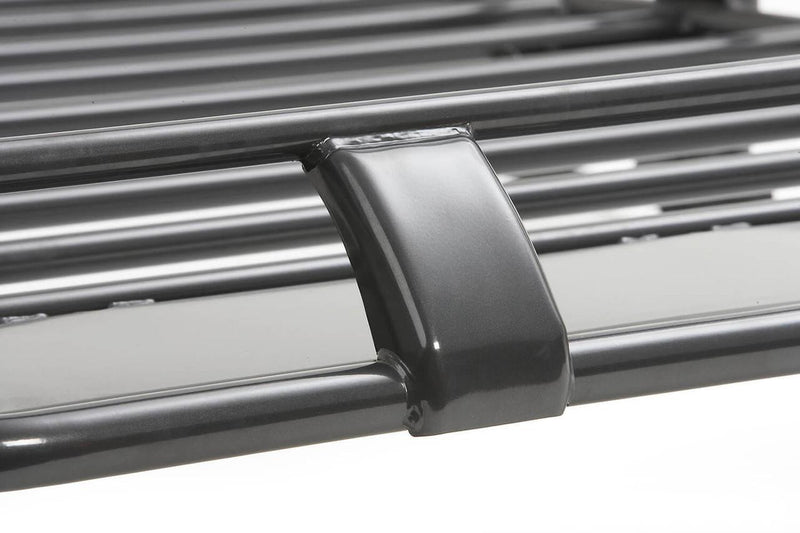 Close-up of the rounded rail clamp joining the side rail tubes of an ARB Classic roof rack cage