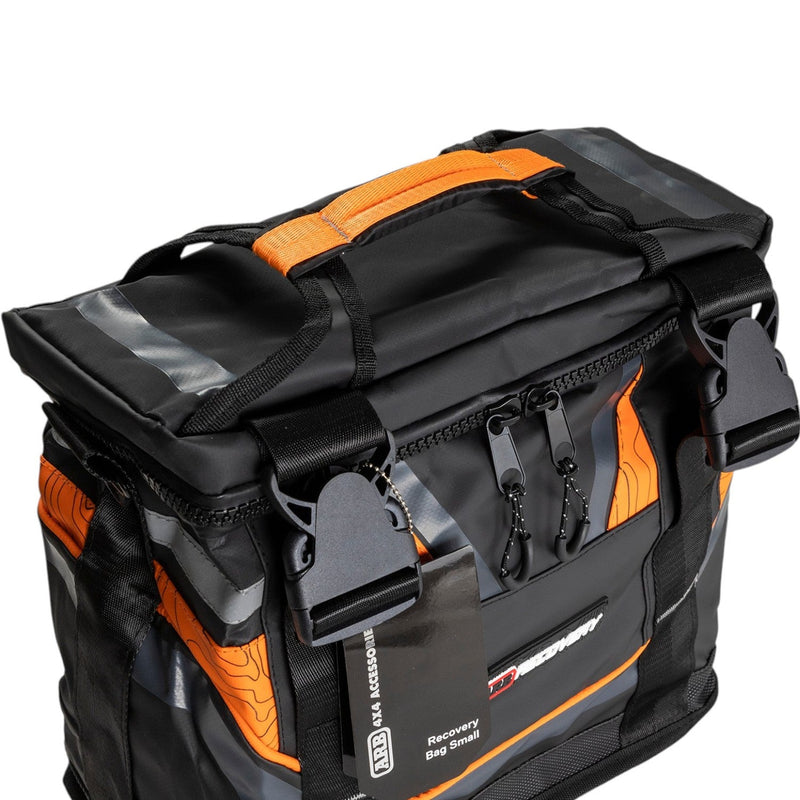 ARB Essentials Recovery Kit laid out with recovery bag, snatch strap, tree trunk protector, snatch block, shackles and gloves, detail view