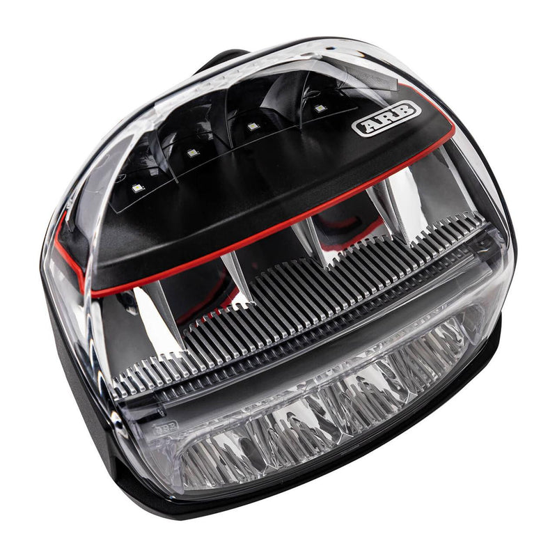 Top-down view of a single ARB Intensity IQ light showing the four upper LEDs behind individual reflectors, the comb-style fin heatsink, the ARB badge and the lower lenticular flood optics