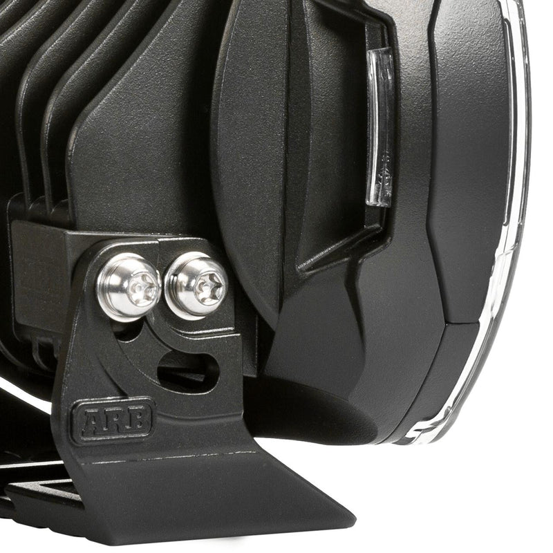 Close-up of the ARB Intensity SOLIS LED driving light stainless mounting bolts and bracket