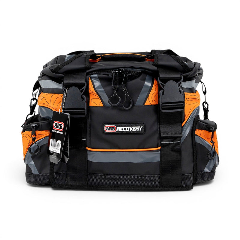 ARB Premium Recovery Kit laid out: large recovery bag with snatch strap, tree trunk protector, winch extension strap, snatch block, shackles and gloves, underside view
