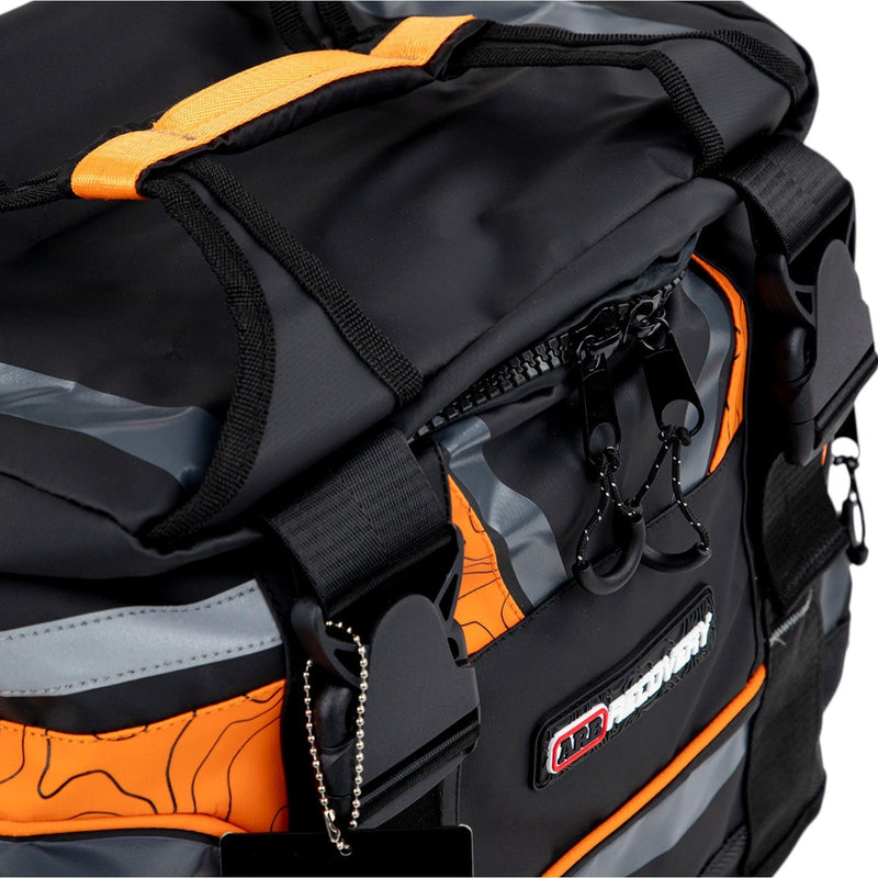 ARB Premium Recovery Kit laid out: large recovery bag with snatch strap, tree trunk protector, winch extension strap, snatch block, shackles and gloves, detail view