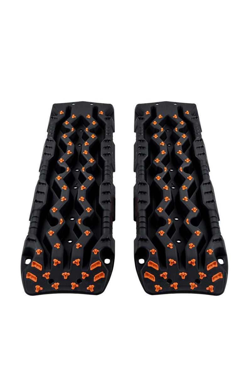 ARB TRED Pro recovery board in black, orange nodules, showing the SIPE-LOCK tooth profile and the shovel end, in use