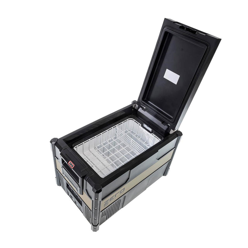 ARB ZERO 38 qt fridge freezer with the quick release lid raised, showing the single zone interior and removable wire basket