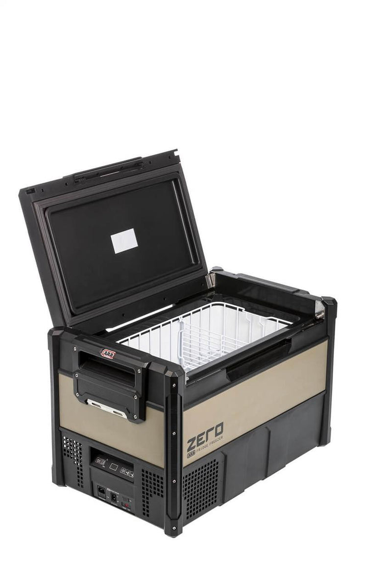 ARB ZERO 63 qt fridge freezer with the lid raised, showing the single zone interior and the removable wire basket