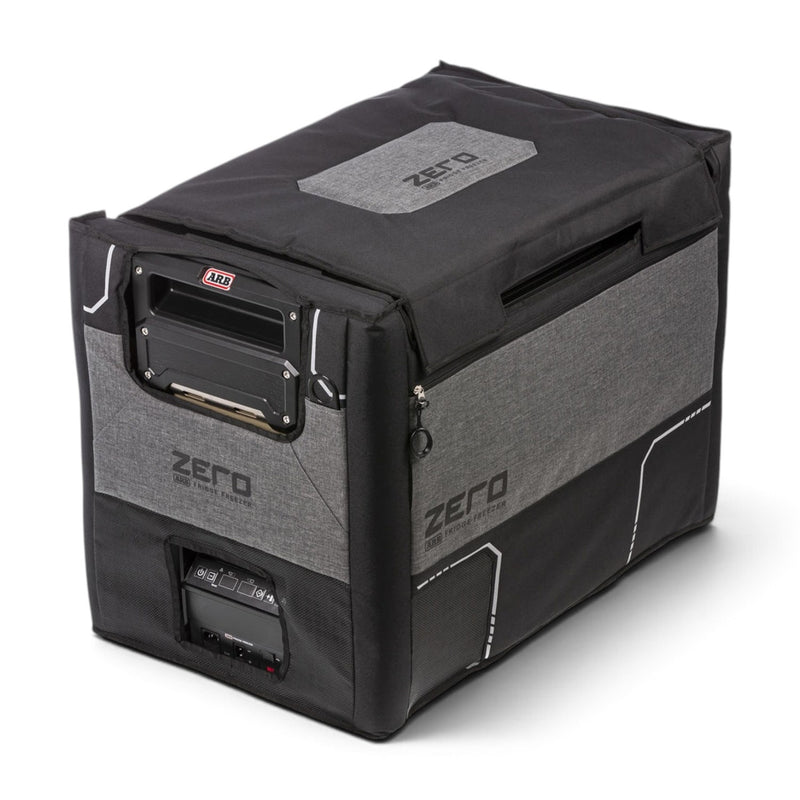 ARB ZERO transit bag for the 73 qt dual zone fridge freezer shown fitted to the cabinet, with the magnetic lid flap closed and the handle and control panel openings visible
